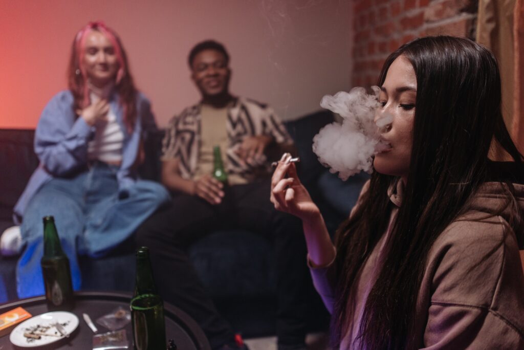 Three people having a marijuana smoking session