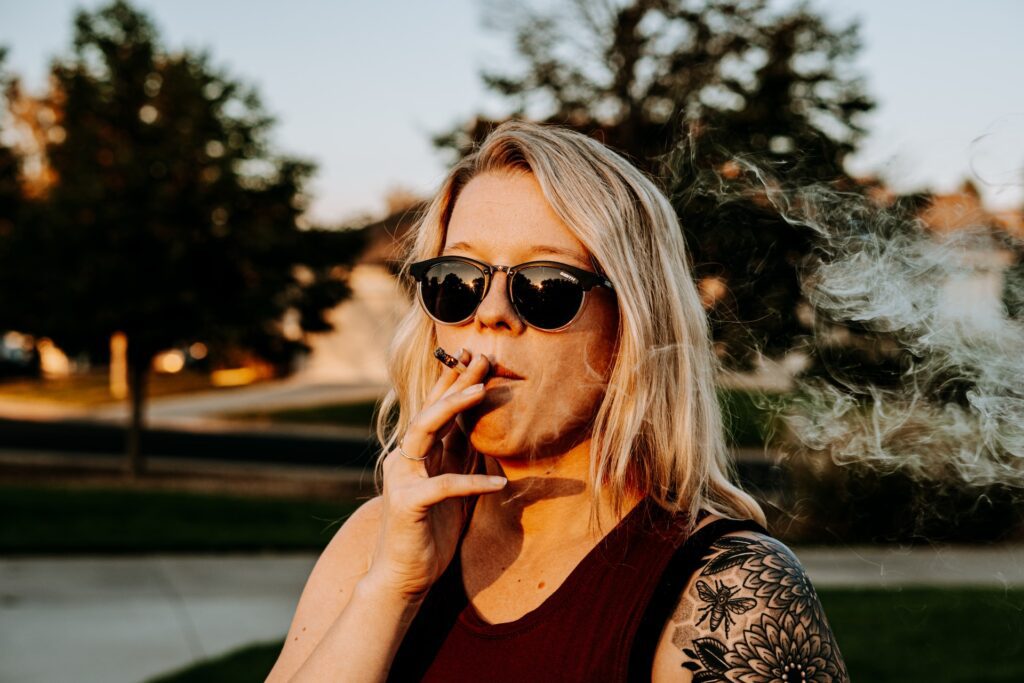 Woman smoking a joint outside