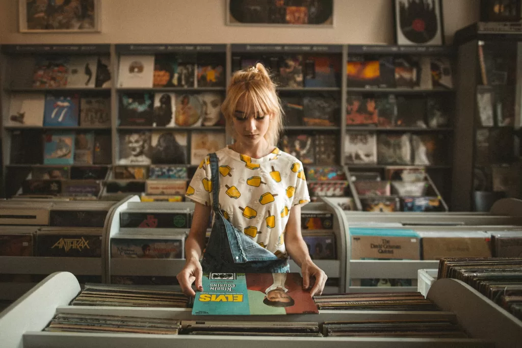Girl in record store