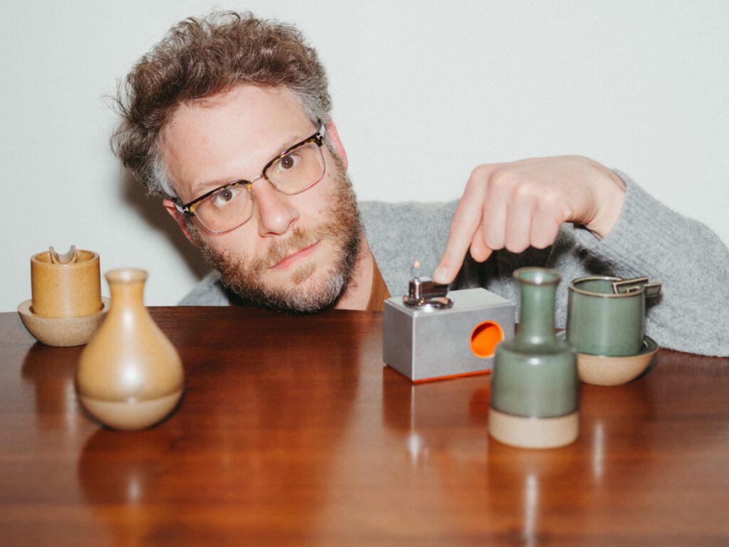 Seth Rogen with lighter and ashtrays